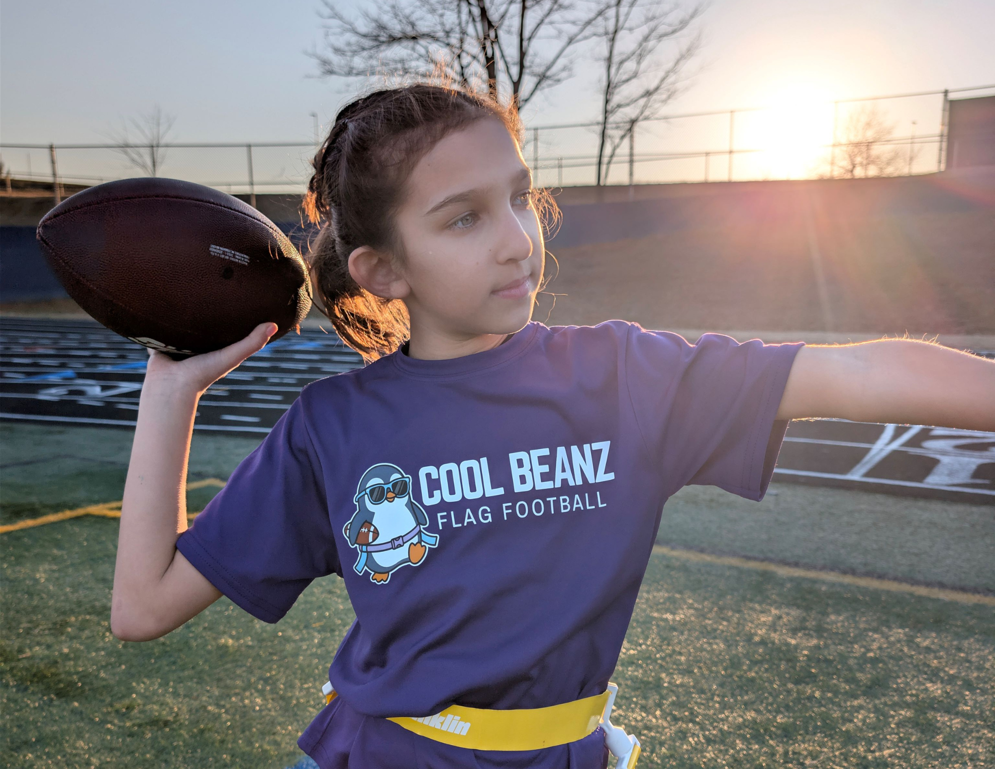 Kids flag football player throwing pass wearing Cool Beanz Flag Football apparel, youth flag football gear and team clothing